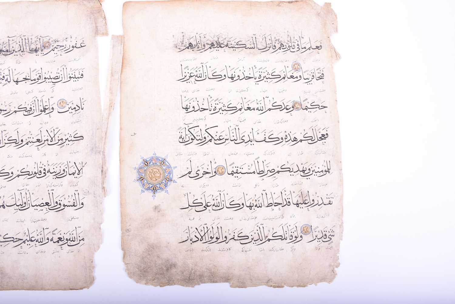Two leaves of Persian script, 18th century, each with illuminated roundels, 40.5cm x 31cmCondition - Image 8 of 18