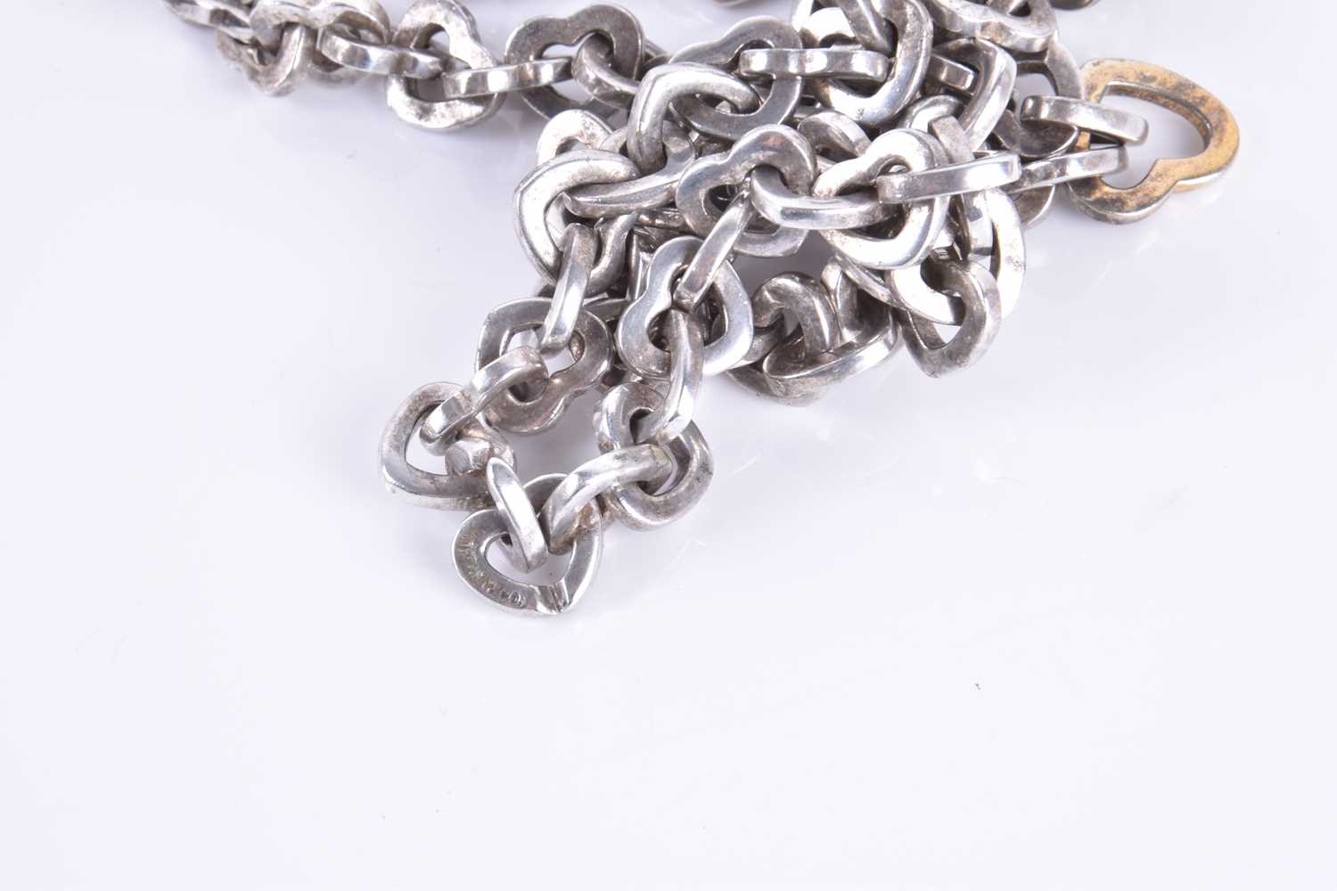 A Tiffany & Co love heart link white metal necklace with two larger gilded links, 43cm long, - Image 4 of 4