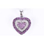 An 18ct white gold, diamond, and pink sapphire pendantof heart-shaped form, set with round-cut