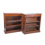 A pair of Edwardian style mahogany and satinwood banded open bookcases, the frieze inlaid with