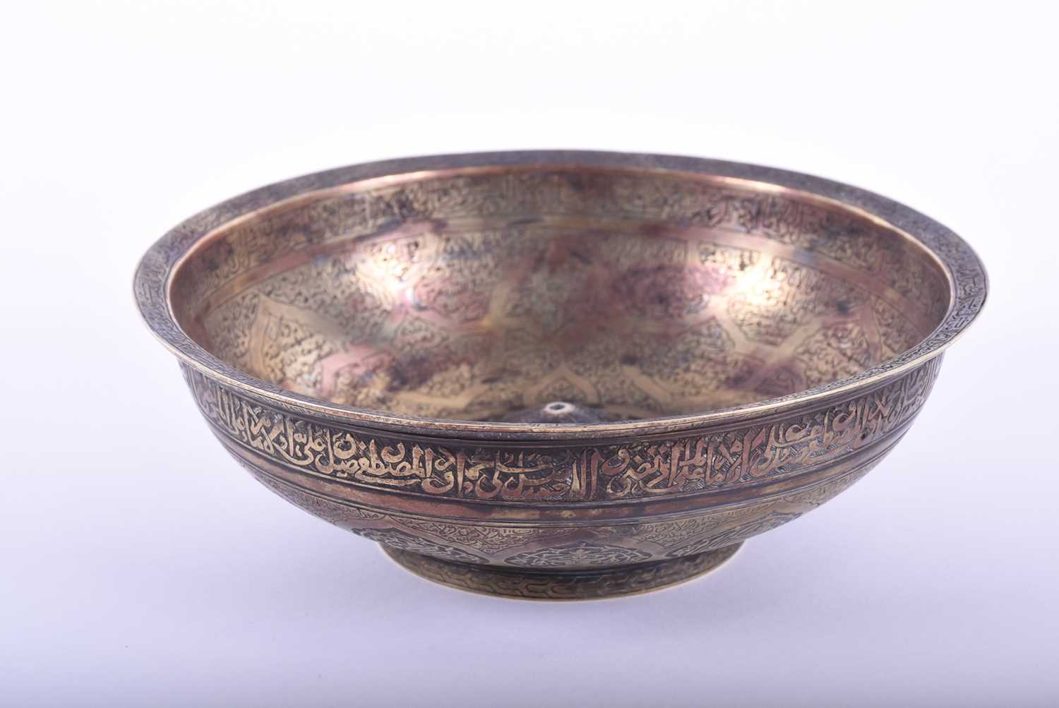 A Persian cast bronze calligraphic bowl, the interior with central raised boss, pierced at the - Image 5 of 5