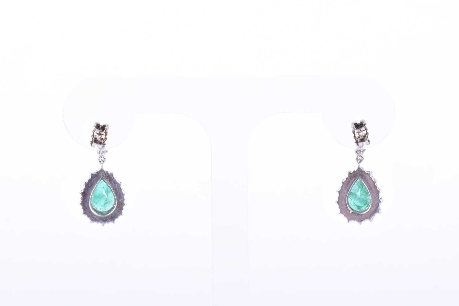 A pair of white gold, diamond, and emerald drop earringseach set with a mixed pear-cut emerald, - Image 2 of 2