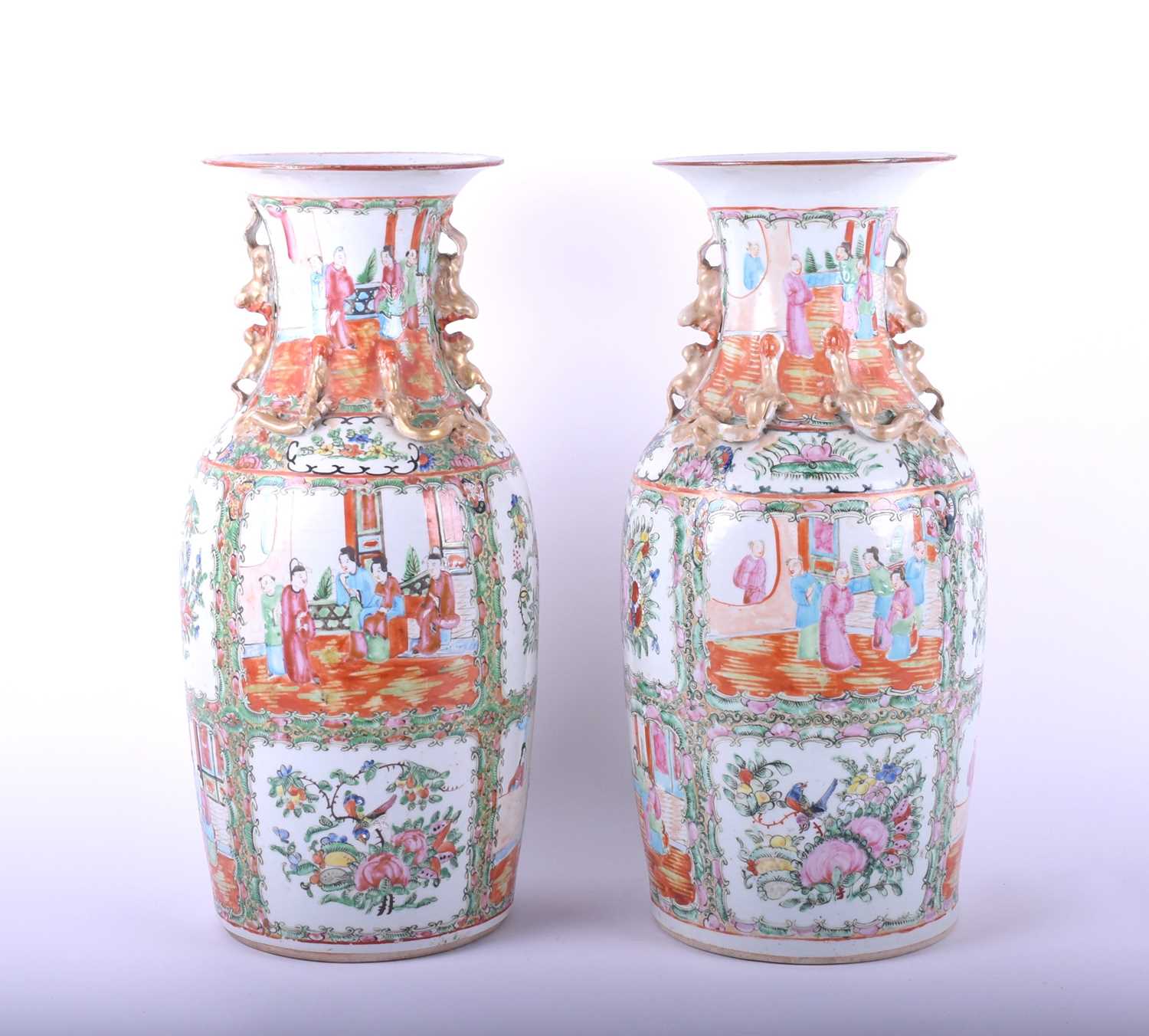 A pair of Chinese Canton enamel vases, late 19th century, the neck and shoulder with applied shi -