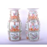 A pair of Chinese Canton enamel vases, late 19th century, the neck and shoulder with applied shi -