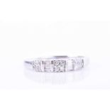 A diamond band ringset with alternating round brilliant-cut diamonds and baguette-cuts, the white