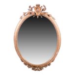 A 19th century gilt framed oval wall mirror, with shaped surmount with bellfowers and olive leaf and