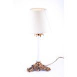 A Victorian table lamp, with opalescent milk glass column with gilt metal leafy mounts and base,
