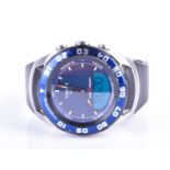 A Tissot Sailing Touch stainless steel quartz wristwatch, the blue dial with large red tipped hands,