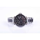 A Tag Heuer Formula 1 ladies black and stainless steel quartz wristwatch, the black dial with