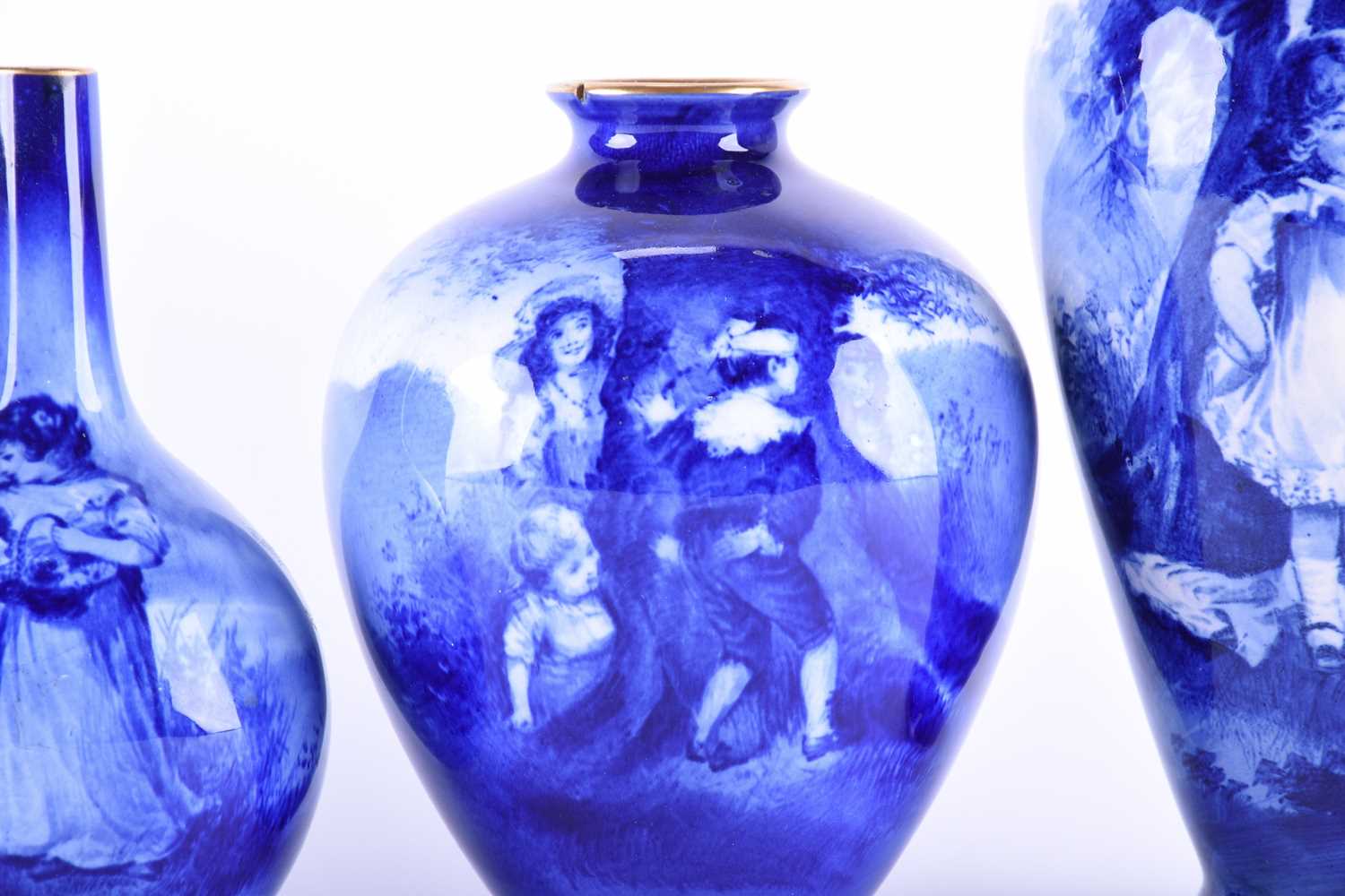 A collection of five Royal Doulton blue children series vases, of