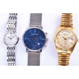 A group of three wristwatches, comprising a West End Watch Co gilt Datejust style watch, a Maurice