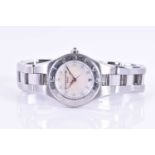 A Baume & Mercier Linea stainless steel ladies wristwatch, the mother-of-pearl dial set with diamond