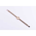 A 9ct yellow gold ladies Accurist wristwatchwith round baton dial, 18.7 grams.