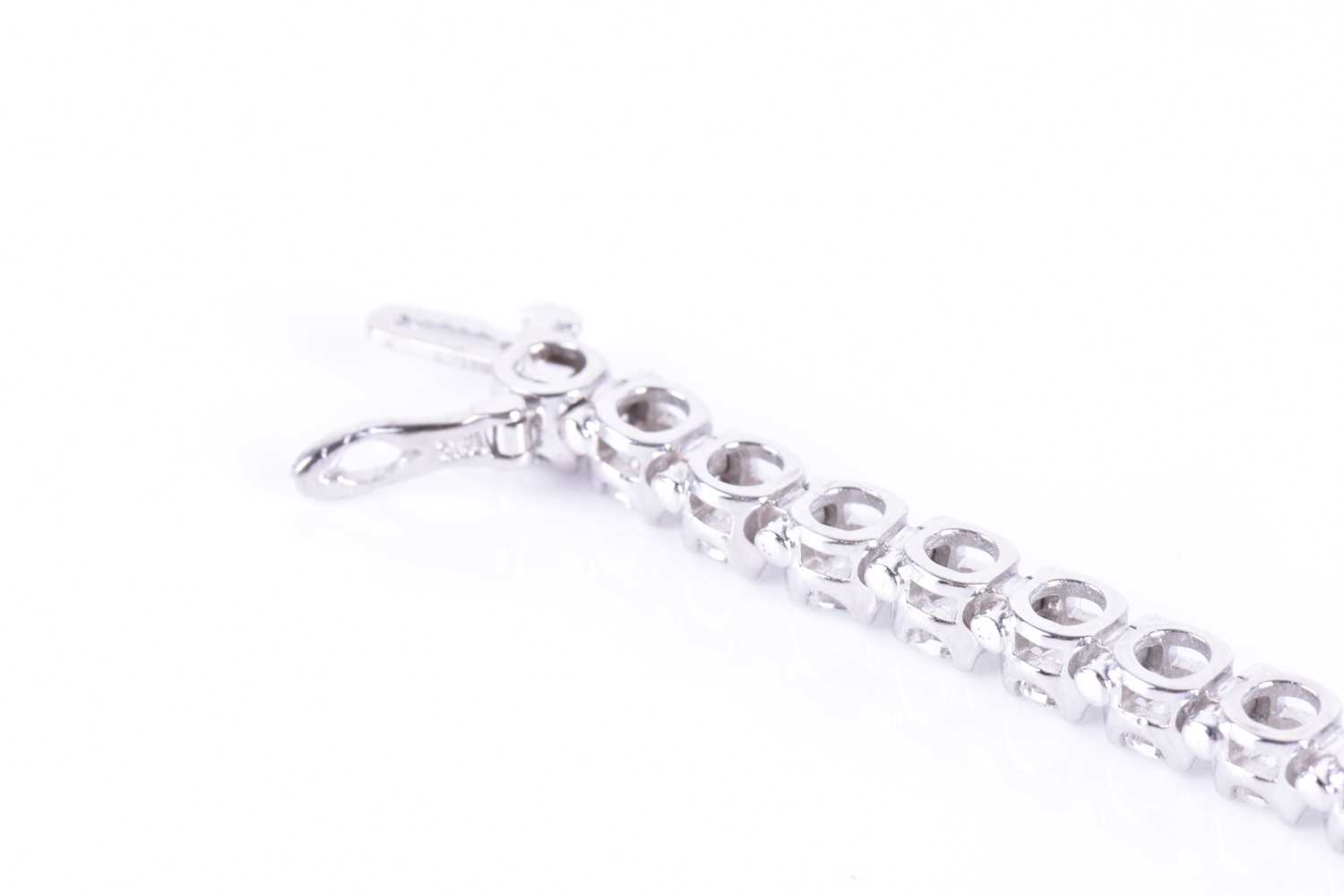 A fine quality 14ct white gold and diamond line bracelet, set with thirty round brilliant-cut - Image 2 of 9