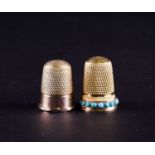 A Victorian yellow metal thimble set with turquoise beads, in fitted presentation case and a further