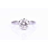 An 18ct white gold and solitaire diamond ring, set with a round brilliant-cut diamond of