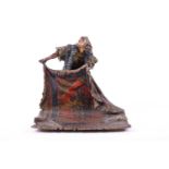 A Franz Bergmann early 20th century Austrian cold painted bronze model of a carpet seller, the