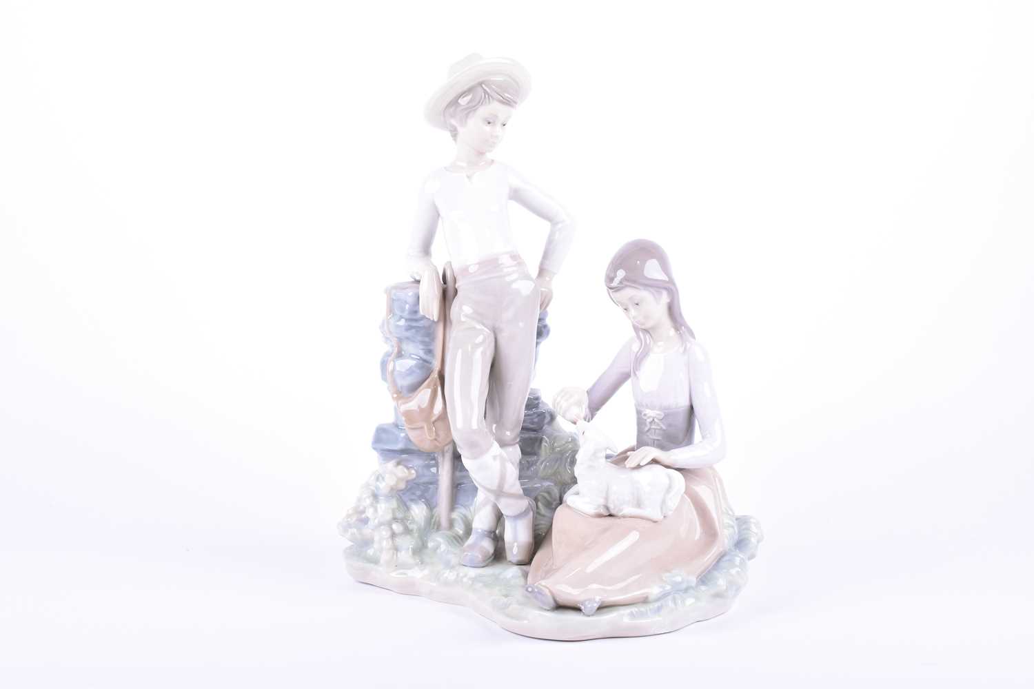 Two Lladro figures comprising a young shepherdess feeding a lamb from a bottle, with shepherd - Image 3 of 7
