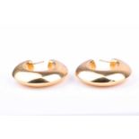 A pair of 18ct yellow gold hoop earringsthe hollow hoops of plain, polished design, the stems marked