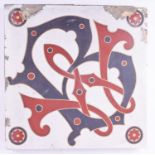 A large Minton encaustic gothic tile, 19th century, monogrammed WB, impressed verso 'Minton & Co,