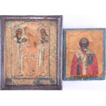 A miniature 19th century painted wood icon depicting St Nicolas in red and white robes, holding an