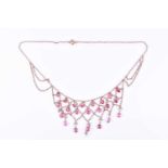 A yellow metal and pink spinel drop pendant necklacethe chain-link mount set with mixed faceted pink