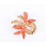 Kutchinsky. An 18ct yellow gold and coral broochset with six carved coral twists and openwork