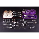 A collection of silver comprising eleven napkin rings, a christening spoon and fork, a set of six
