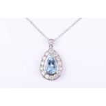 A diamond and aquamarine pendant, set with a mixed pear-cut aquamarine bezel-set within a border