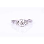 A platinum and diamond ringcentred with an old round-cut diamond of approximately 0.80 carats,