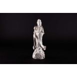 A Chinese Blanc de chine figure of Guanyin, 20th century, her face an expression of extreme