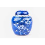 A Kangxi period blue and white ginger jar and matched cover, early 18th century, decorated in prunus