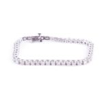A 14ct white gold and diamond tennis braceletset with forty six round brilliant-cut diamonds of