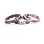 Two early to mid 20th century 9ct white gold and paste stone eternity ringsinset with blue and