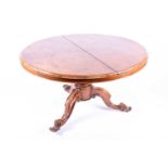 A Victorian burr walnut quarter veneered circular table, tilt-top, on a tripod base, 75 cm high x