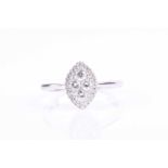 An 18ct white gold and diamond ring, the marquise-shaped mount inset with round brilliant-cut