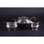 A George V silver three-piece silver tea set, London 1916, by Vander and Hedges, comprising a