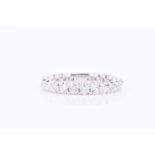 A platinum and diamond eternity ringset with round brilliant-cut diamonds of approximately 1.44