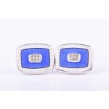 A pair of silver, diamond, and enamel cufflinksof rectangular form, centred with six round-cut
