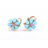 A pair of 14ct yellow gold, turquoise, and ruby floral earrings, each centred with a ruby and set
