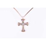 An 18ct yellow gold, diamond, and multi-coloured gemstone cross pendantpave-set with brown and white