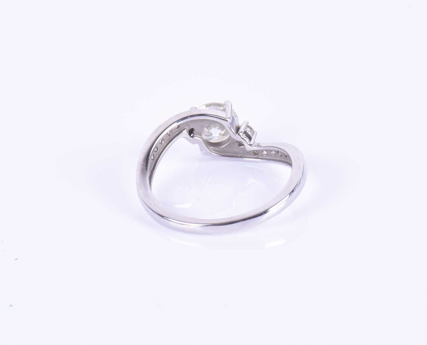 A 14ct white gold and diamond ring, centered with a round brilliant-cut diamond of approximately 0. - Image 4 of 7