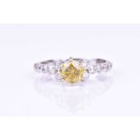 A 14ct white gold and fancy diamond ringset with a round brilliant-cut fancy yellow diamond of