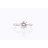 A solitiare diamond ringset with a round brilliant-cut diamond of approximately 0.90 carats, eight-