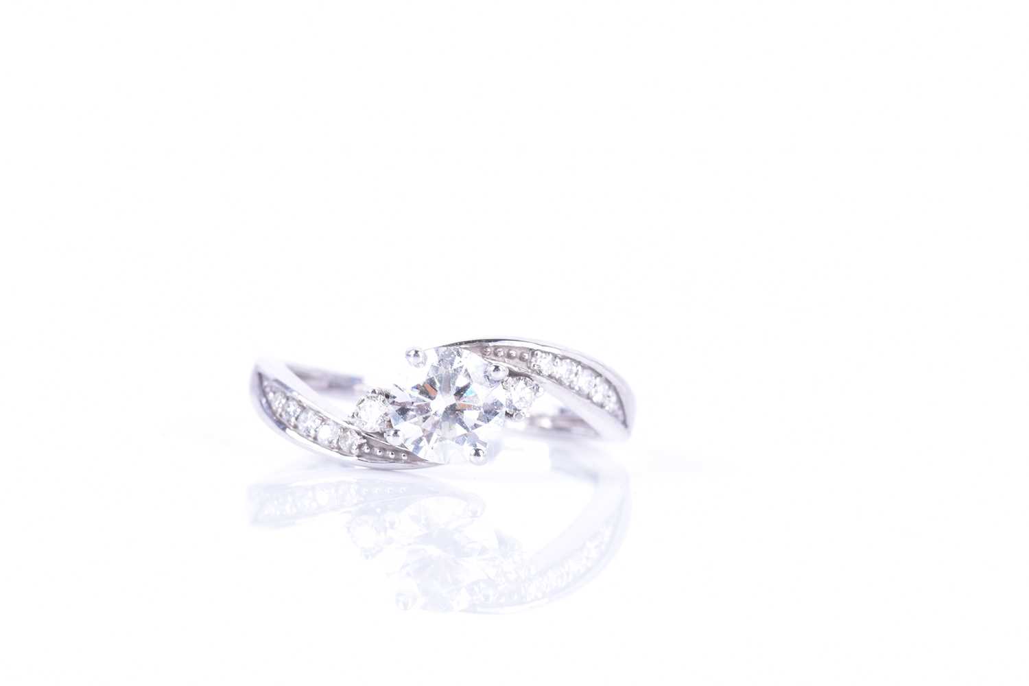 A 14ct white gold and diamond ring, centered with a round brilliant-cut diamond of approximately 0. - Image 3 of 7