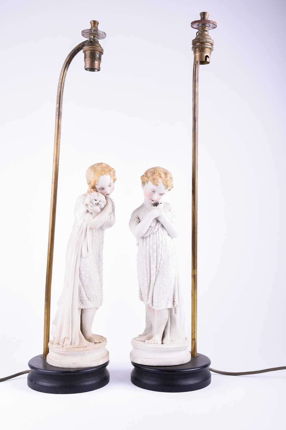 A group of Continental porcelain and bisque figures, late 19th century, to include a pair of young - Image 4 of 7