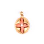 A Victorian yellow gold, coral, and pearl pendant, of oval form, inset with four tapered pieces of