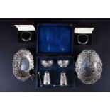 A collection of mixed silver items comprising two dishes and a pair of boxed napkin rings, various