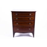 A 19th century mahogany chest of drawers, of small proportions, with a slightly bowed front