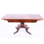 A good quality Regency Rosewood sofa table, the figured crossbanded top with a pair of hinged flaps,